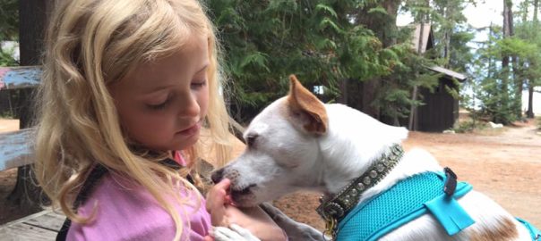 Dr. Becker's granddaughter with his dog QT Pi