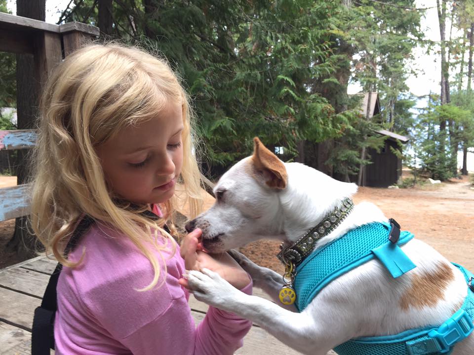 Dr. Becker's granddaughter with his dog QT Pi